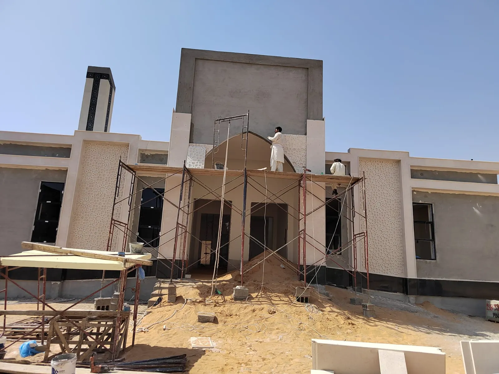 Mosque under construction with scaffolding