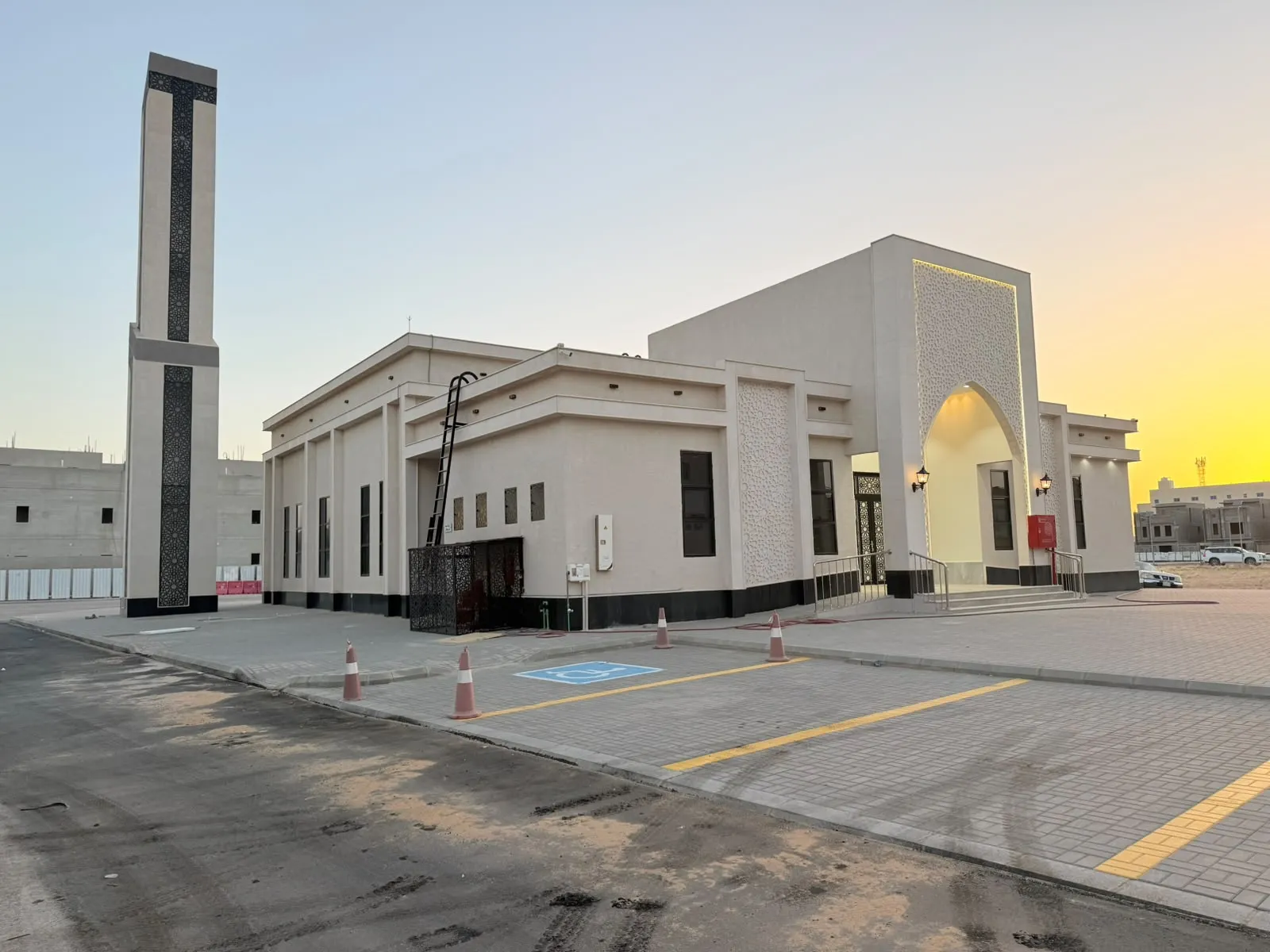 Mosque exterior with minaret at dusk